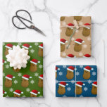 Happy Christmas Potatoes Wrapping Paper Sheets<br><div class="desc">Adorable collection of wrapping paper featuring a happy smiling Christmas Potato wearing a Santa hat and white snowflakes dotted around on a various background colors.</div>