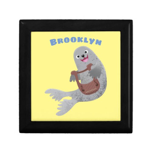 Happy cute harp seal cartoon illustration gift box