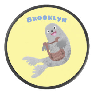 Happy cute harp seal cartoon illustration hockey puck