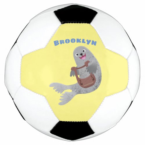 Happy cute harp seal cartoon illustration soccer ball