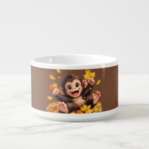 Happy Cute Monkey Playing in Falling Autumn Leaves Bowl