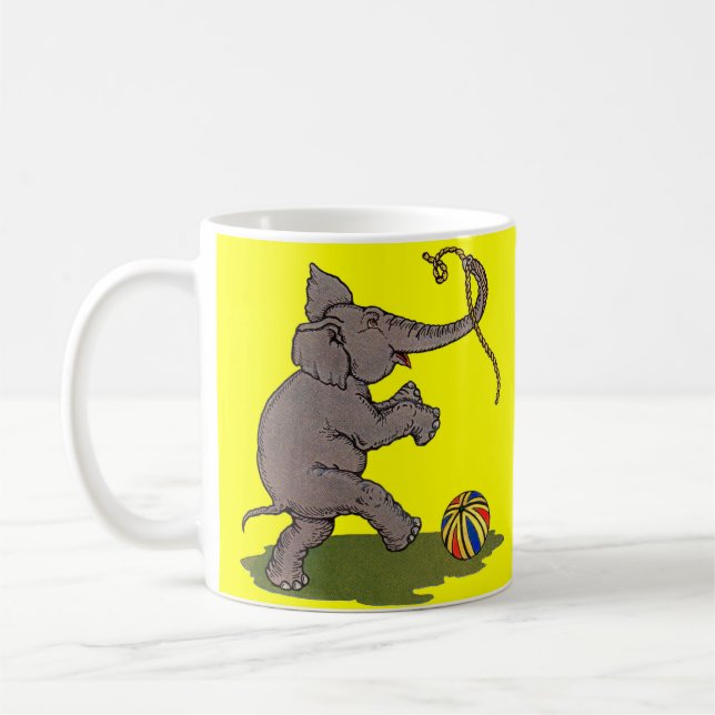 happy elephant playing with rope and ball coffee mug (Left)