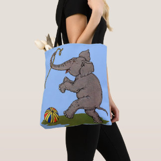 happy elephant playing with rope and ball tote bag