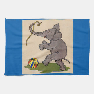 happy elephant playing with rope and ball towel
