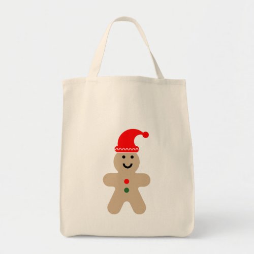 Happy Gingerbread man wearing a Santa hat Tote Bag