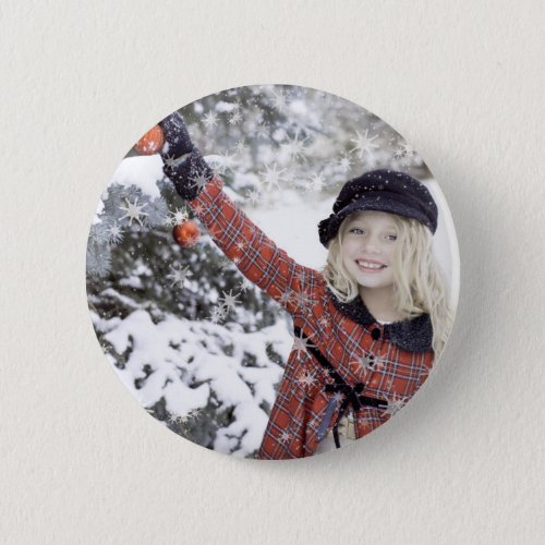 Happy girl decorating Christmas tree Button