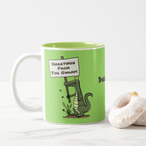Happy green cartoon crocodile with sign cartoon Two_Tone coffee mug