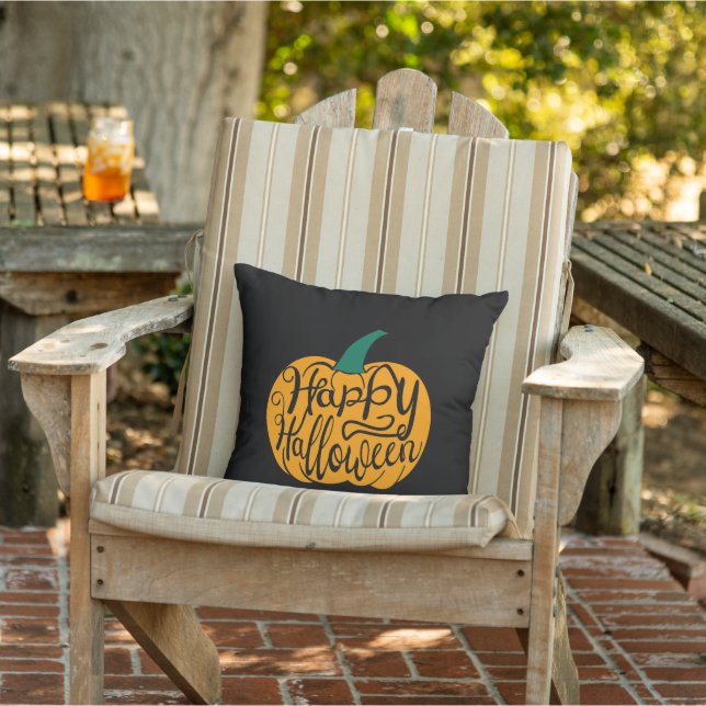 Happy Halloween lettering on carved pumpkin Outdoor Pillow (Chair)