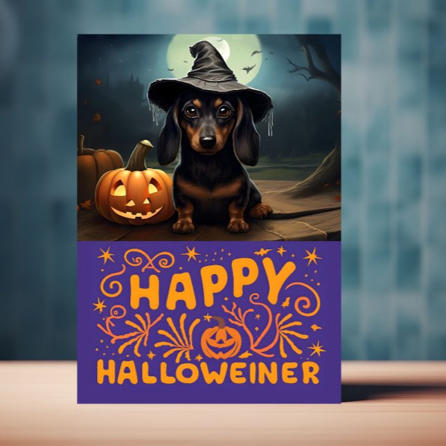 Happy Halloweiener Cute Dog Card (Halloween card with Weiner dog on front is displayed on a table top)