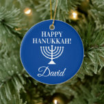 Happy Hanukkah blue menorah custom Jewish Holiday Ceramic Ornament<br><div class="desc">Happy Hanukkah blue menorah custom Jewish Holiday Christmas tree ornament. Add your own custom name,  greeting or monogram letters. Personalized design for Jewish Holidays. Elegant x-mas decorations with religious candle holder symbol. Upload your own family photo on back optionally. Includes gold glitter string.</div>