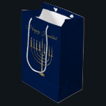 Happy Hanukkah Faux Gold Menorah Blue Holiday Medium Gift Bag<br><div class="desc">Wrap your gifts in style this holiday season with our elegant Hanukkah gift bags. This simple but chic design features a navy blue background with a large faux gold menorah in the center. Above it reads "Happy Hanukkah". Designed by artists  © Tim Coffey and Susan Coffey.</div>