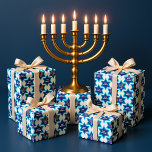 Happy Hanukkah  Wrapping Paper<br><div class="desc">This festive Jewish wrapping paper features a repeating pattern of bold blue Stars of David framing the cheerful message “Happy Hanukkah.” Within the design, a classic nine-branched Hanukkah menorah (hanukkiah) glows with colorful candles — red, yellow, and orange flames shining brightly. The cool blue tones create a vibrant contrast with...</div>