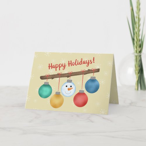 Happy holidays balls tree ornaments on branch holiday card