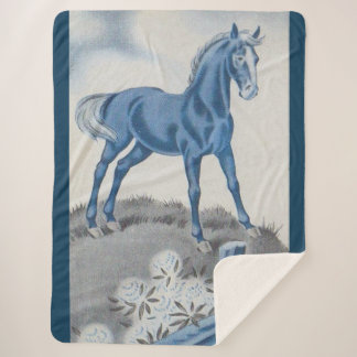 happy horse in blue sherpa blanket