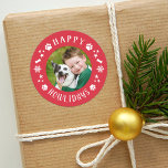 Happy Howlidays Red Pet Dog Photo Classic Round Sticker<br><div class="desc">Holiday stickers feature a round photo of your favorite puppy dog with festive red "Happy Howlidays" frame that includes white modern text,  paw prints,  stars,  snowflakes,  and dog bone accents. The red background color can be customized. These stickers work well as Christmas card envelope seals!</div>