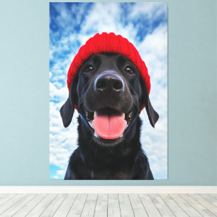 Happy Labrador in a Red Beanie Under a Blue Sky Canvas Print