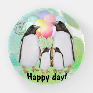 Happy penguin family with colorful balloons paperweight
