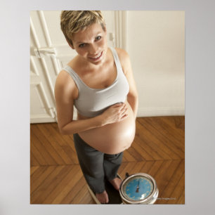 Happy pregnant woman standing on scale poster