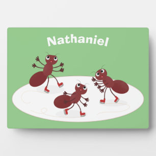 Happy red ants ice skating cartoon plaque
