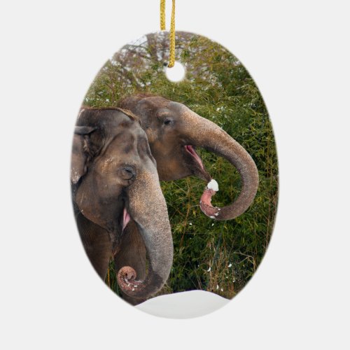 Happy smiling cute elephants playing in the snow ceramic ornament
