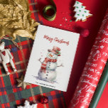 Happy Snowman Merry Christmas Custom Family Name Holiday Card<br><div class="desc">This charming holiday card features a joyful snowman illustrated in soft watercolor, adding a cheerful and festive touch to your holiday greetings. The inscription "Merry Christmas" is elegantly placed above the snowman, while the bottom of the card offers a customizable space for your family name, making it uniquely personal. On...</div>