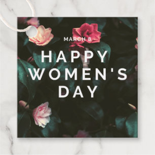 Happy women's day text on floral favor tags