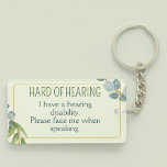 Hard of Hearing Deafness Alert Green Leaves Keychain<br><div class="desc">Another cute hard-of-hearing keyring by JessicaAmber - message me about custom orders! This keyring features the slogan 'Hard of Hearing' in a narrow font, surrounded by a green wreath of leaves, on a pale green background. Underneath is an area for more info on your disability. On the back is space...</div>