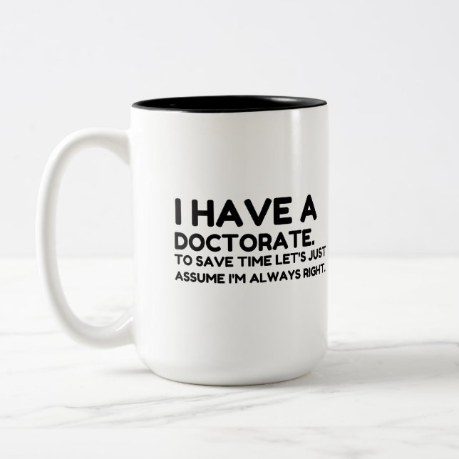 HAVE A DOCTORATE IN SAVING TIME Two-Tone COFFEE MUG (Left)