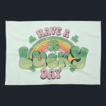 Have a Lucky Day Retro Typography Kitchen Towel<br><div class="desc">A kitchen towel with a St. Patrick's Day themed image. A retro grunge style design which says: Have a lucky day. With a colorful rainbow behind. Words written in a fat rounded retro style vibe. Pink and green colors.</div>