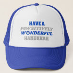 Have a Pawsitively Wonderful Hanukkah Trucker Hat<br><div class="desc">This delightful design showcases the heartfelt text "Have a pawsitively wonderful Hanukkah." The text is presented in blue and silver colors, with the letter "o" in "wonderful" playfully substituted with a paw print. This design captures the joy and celebration of Hanukkah with a pet-friendly twist. The combination of blue and...</div>