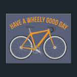 Have a Wheely Good Day Bicycle Postcard<br><div class="desc">Send a fun greeting to your favorite cyclist or bike rider with this postcard. It features the funny play on words message, "Have a Wheely Good Day" in orange above a matching orange bicycle against a slate blue background. The blank back is ready for you to add your own personalized...</div>