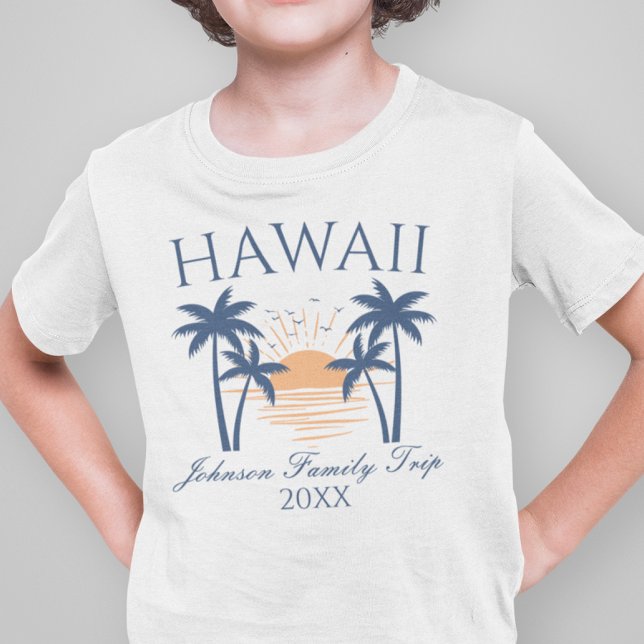 Hawaii Family Vacation Trip T-Shirt (Boy wearing a Hawaii family trip t-shirt with a sunset and palm tree design.)