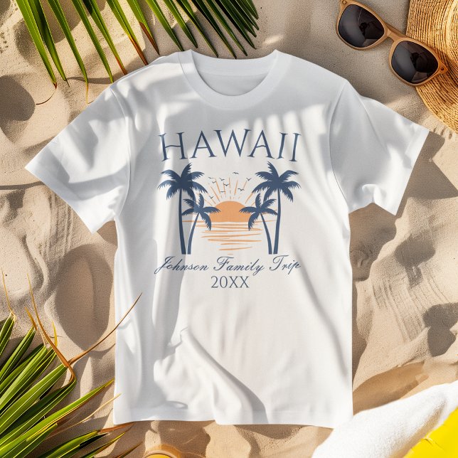 Hawaii Family Vacation Trip T-Shirt (White "Hawaii Family Trip" t-shirt with a tropical design on beach sand, paired with sunglasses.)