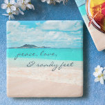 Hawaii Tropical Beach Peace Love Sandy Feet Script Stone Coaster<br><div class="desc">“Peace, love & sandy feet.” Relax with your favorite beverage on this stunning pastel-colored photo stone coaster, all while you remind yourself of the fresh salt smell of the ocean air. Exhale and explore the solitude of an empty Hawaiian beach. Makes a great housewarming gift! You can easily personalize this...</div>