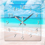 Hawaii tropical sandy beach turquoise ocean photo square wall clock<br><div class="desc">Remind yourself of the fresh salt smell of the ocean air whenever you check the time on this stunning, vibrantly-colored photo wall clock. Exhale and explore the solitude of an empty Hawaiian beach. Your choice of a round or square clock face. Makes a great housewarming gift! You can easily personalize...</div>