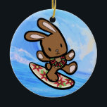 Hawaiian Surfing Bunny Holiday Cartoon Ceramic Ornament<br><div class="desc">There is nothing better than a tropical vacation during the winter holidays! And even better, our adorable surfing bunny, Coco takes on the big waves on the North Shore of Oahu, Hawaii. He brings with him the Aloha sprit for the holidays and wishes you a "Mele Kalikimaka" (Merry Christmas). This...</div>