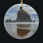 Haystack Rock, Cannon Beach, Oregon Ceramic Ornament<br><div class="desc">The iconic Haystack Rock reflects in the ocean below dramatic clouds at Cannon Beach on the Oregon Coast</div>