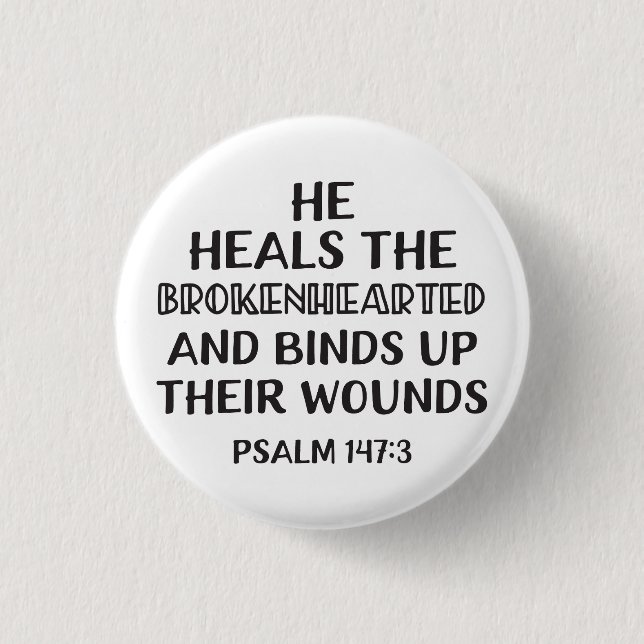 He heals the brokenhearted and binds up their woun button (Front)