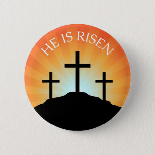 He is risen cross against sunrise Easter button