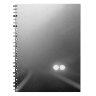 Headlights from a windscreen on a rainy night notebook