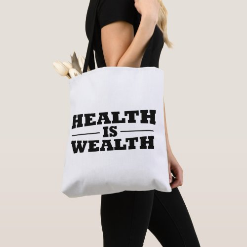 Health is wealth tote bag
