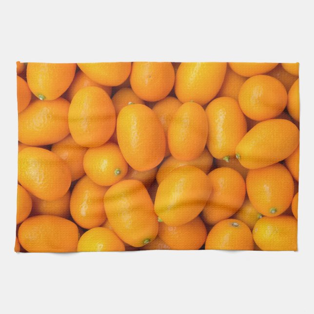 Heap of orange kumquats in cardboard box towel (Horizontal)