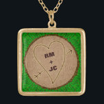 Heart Carved Initials Wood Tree Rings Personalized Gold Plated Necklace<br><div class="desc">This beautiful, romantic rustic nature square necklace design is perfect for a wedding, anniversary or Valentine's Day. It has a wood texture look, like the top view of a tree stump complete with rings and a bark border with green grass. A heart with arrow has been carved into it. Use...</div>