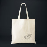 Heart Locket & Bow Illustration Custom Wedding Tote Bag<br><div class="desc">Celebrate your love story with these custom wedding totes, featuring a romantic locket and bow design. Perfect for couples who cherish sentimental touches, these totes are personalized with your initials and wedding date. The minimalist black and white style fits seamlessly into any wedding theme, whether it’s a vintage-inspired affair or...</div>