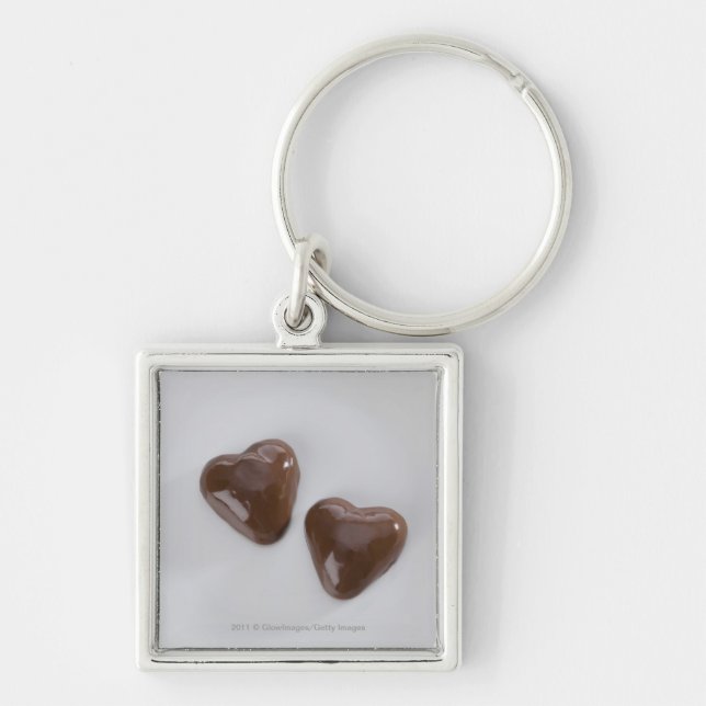 Heart shaped chocolate candies on a plate keychain (Front)