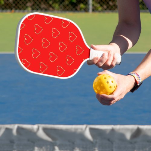 Heart shaped hearts on red pickleball paddle