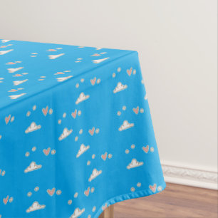 Hearts and clouds on blue tablecloth