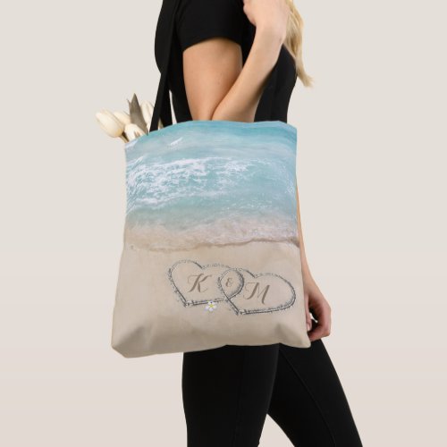 Hearts in Sand | Monogram Couple Beach Tote Bag - Modern tropical beach tote bag featuring sand, sea, and two hearts in the sand with your initials.