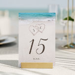 Hearts in the sand destination beach wedding table number<br><div class="desc">Features two hearts in the sand and the bride's and groom's initials with turquoise water and white sand beach background,   great table cards for summer beach wedding,  or tropical destination wedding.</div>