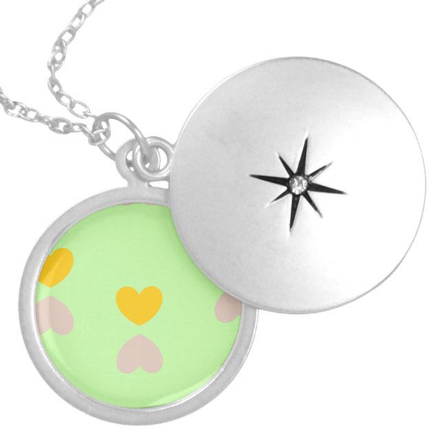Hearts shapes on light green locket necklace (Front)